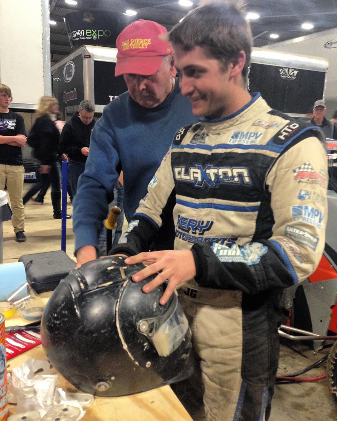 His suit is dirty, his helmet is chipped, he's got an $8,000 car, but this guy is in…