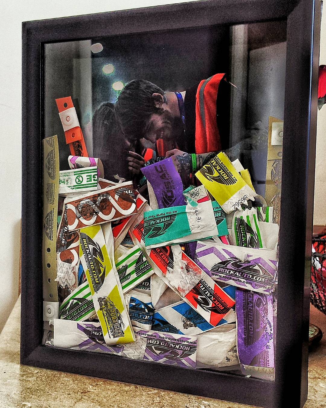 So made this awesome shadow box full of all our pit passes with a photo of us from…